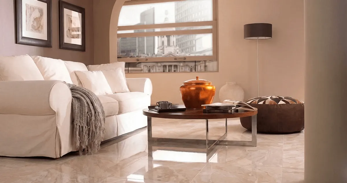 Modern living room with professionally installed marble flooring, a beige sofa, coffee table in Cincinnati, OH